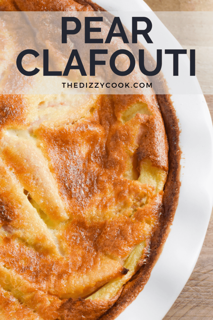 Pear Clafouti in a white baking dish on a wooden table