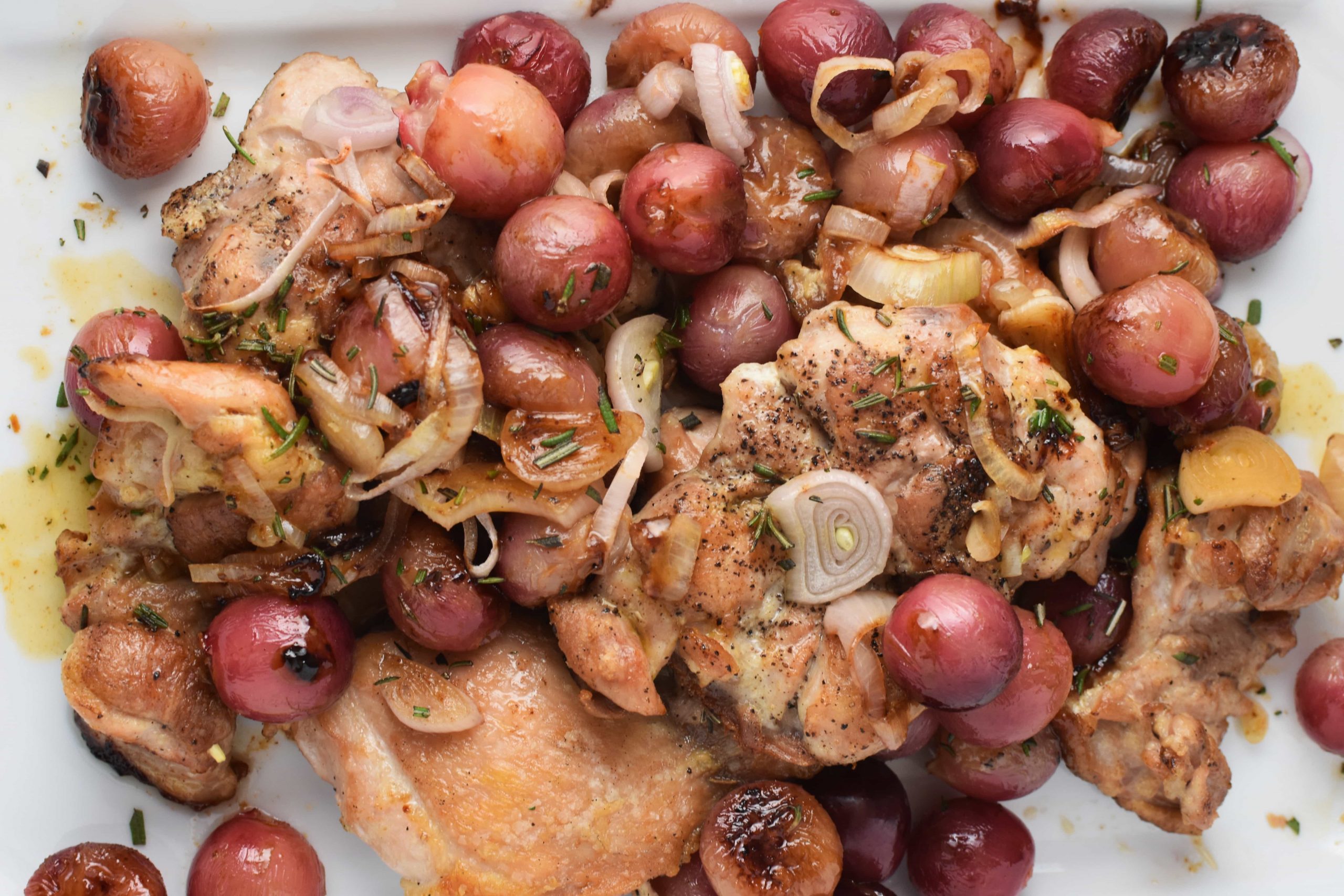 Garlicky Herbed Spatchcock Chicken Roast with Grapes and Onions