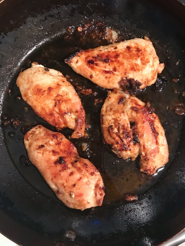 Chicken breasts in a cast iron pan