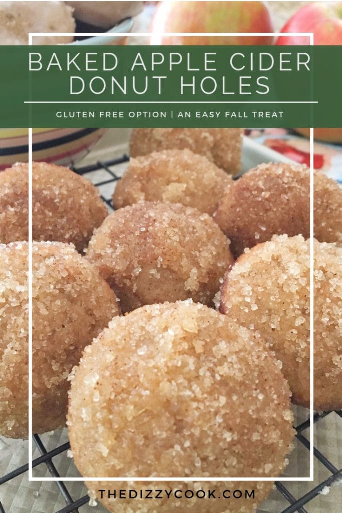 apple cider donut holes on a rack with apples in the background