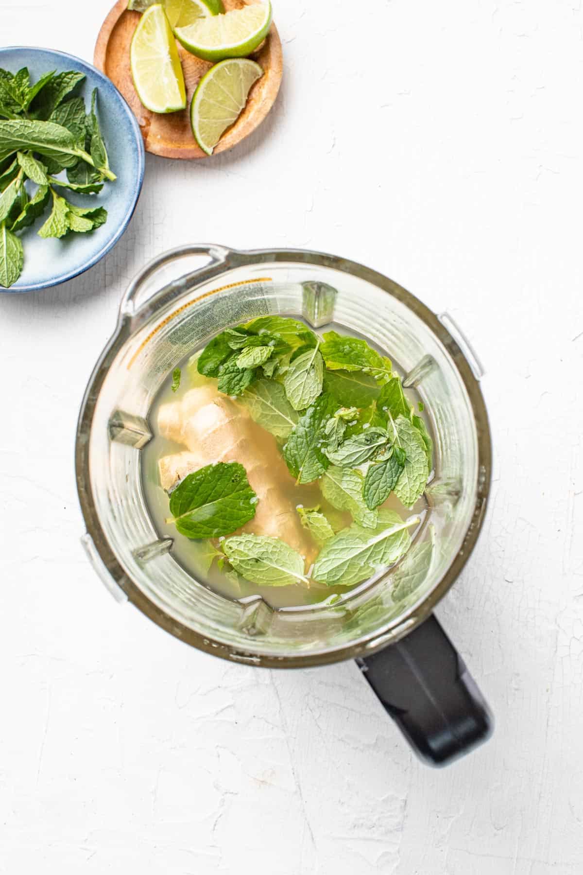 Ginger, mint, and pear juice in a blender.