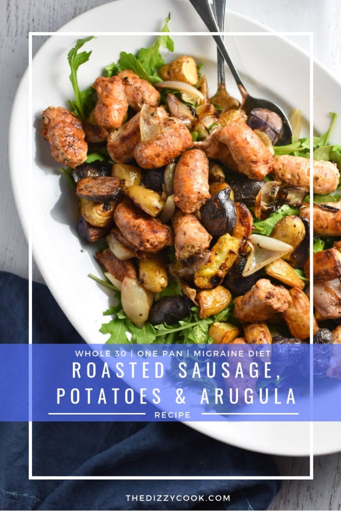 Looking for an easy, one pan dinner? This salad with arugula is topped with sweet roasted shallots, potatoes, and chicken sausage for the perfect, healthy fall meal that's gluten free and whole 30 #healthy #weeknightdinner #migrainediet #whole30
