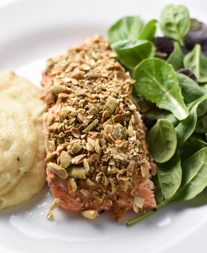 This recipe for pepita crusted salmon is nut free, dairy free, low carb, whole 30, and super easy to make. Roasted on one pan, it's perfect for a weeknight dinner that's Heal Your Headache HYH migraine diet safe. #salmon #dinner #whole30 #paleo #migrainediet