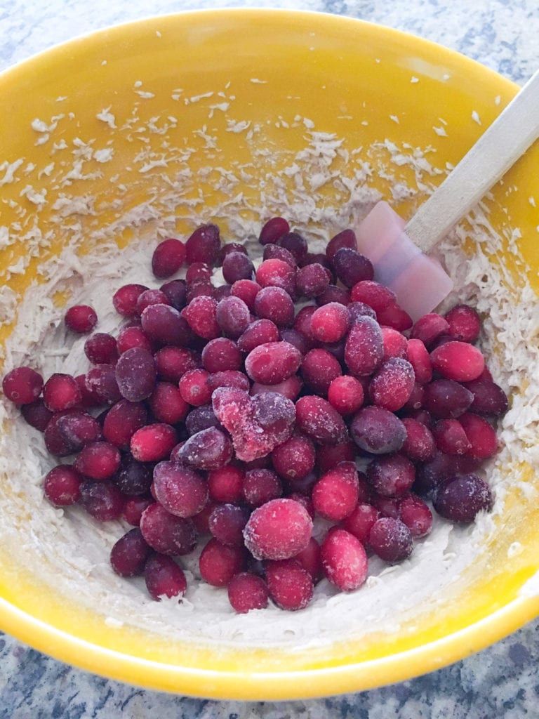 The perfect fall muffin for your Thanksgiving or Christmas breakfast! Light and fluffy, these cranberry pomegranate muffins can be made gluten free. #vegetarian #muffins #fall #cranberry #pomegranate