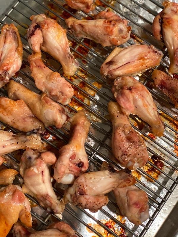 Cooked chicken wings on a sheet pan
