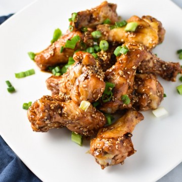 The greatest game day appetizer or even weeknight dinner, these ginger sesame wings are healthy and easy to make. They're whole 30, paleo, and migraine diet safe. #wings #gameday #appetizers