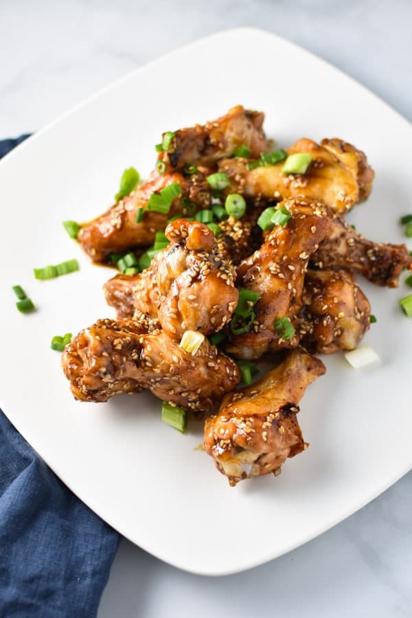 The greatest game day appetizer or even weeknight dinner, these ginger sesame wings are healthy and easy to make. They're whole 30, paleo, and migraine diet safe. #wings #gameday #appetizers