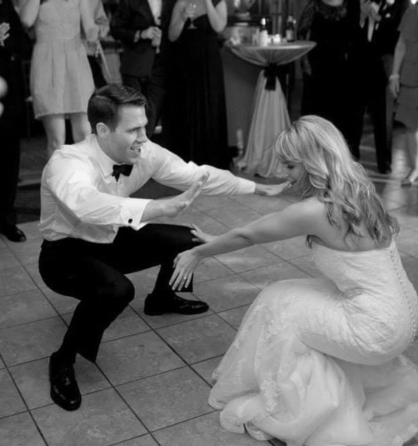 A bride and groom dancing at their wedding