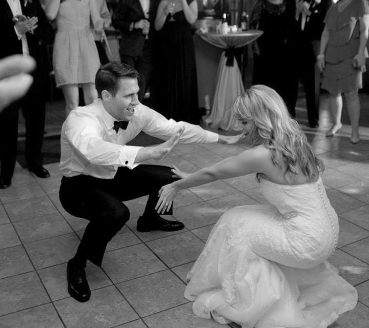 A bride and groom dancing at their wedding