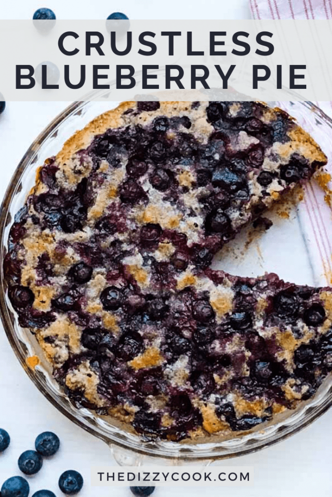 A crustless blueberry pie in a pie plate with a slice missing