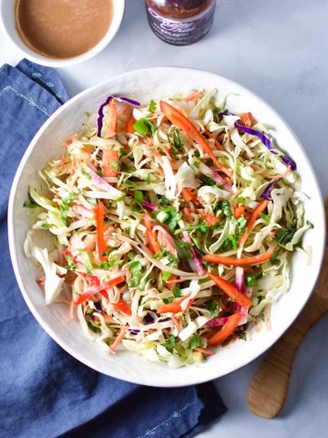 Peanut and nut free, this Thai Vegan Noodle Salad with Sunflower Dressing is the perfect cool salad on a hot day. Loaded with veggies and tossed in a creamy sunflower seed butter sauce, it's a fresh take on takeout. #thainoodle #peanutfree #soyfree #allergyfriendly
