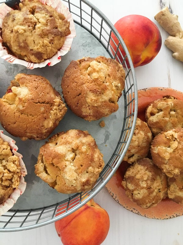 A silver platter of muffins with peaches and ginger