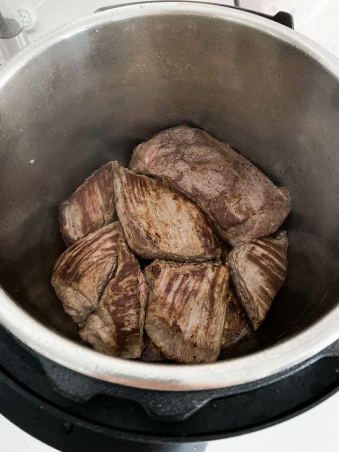 Seared flank steak in an instant pot.