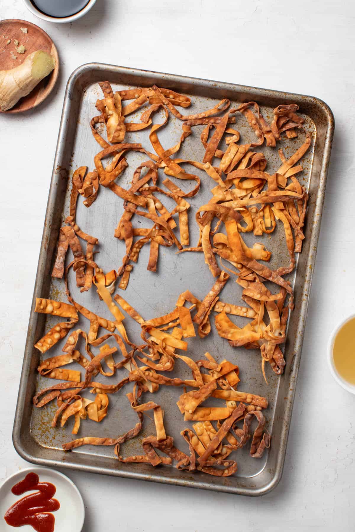 Golden brown egg roll strips after baking.