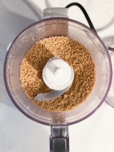 sunflower seeds being ground in a small food processor