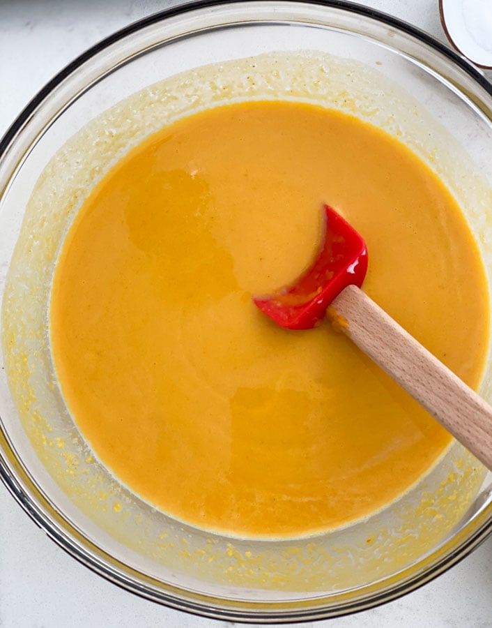 mixing pumpkin puree and milk together in a bowl