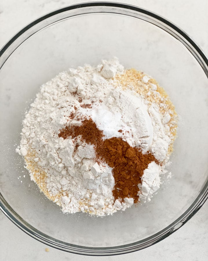 dry ingredients for cornbread like flour and spices in a bowl