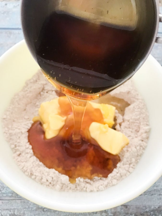 honey being poured into cookie batter