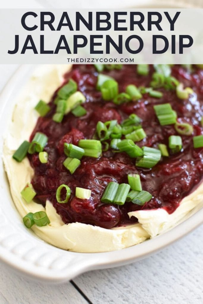 A bowl of cranberry jalapeno dip with scallions on top