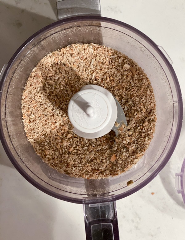 Pumpkin seed flour being ground in a food processor