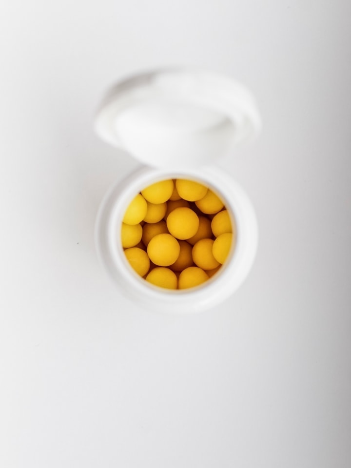 A bottle of yellow pills