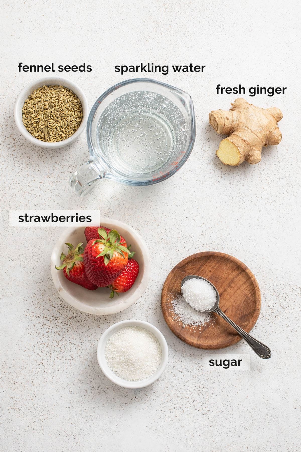 Ingredients for strawberry mocktails with ginger and fennel.