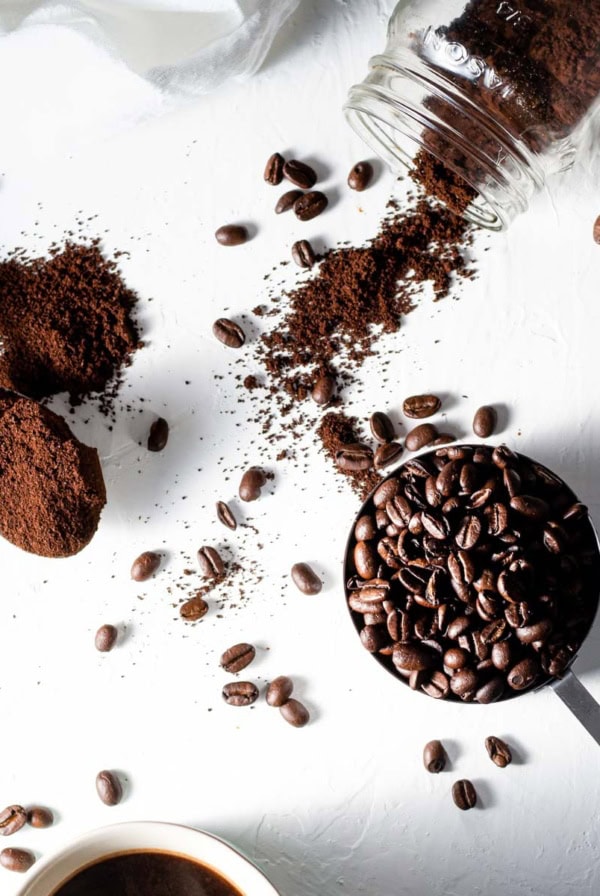 Coffee, chocolate, and cocoa spilled on a white table
