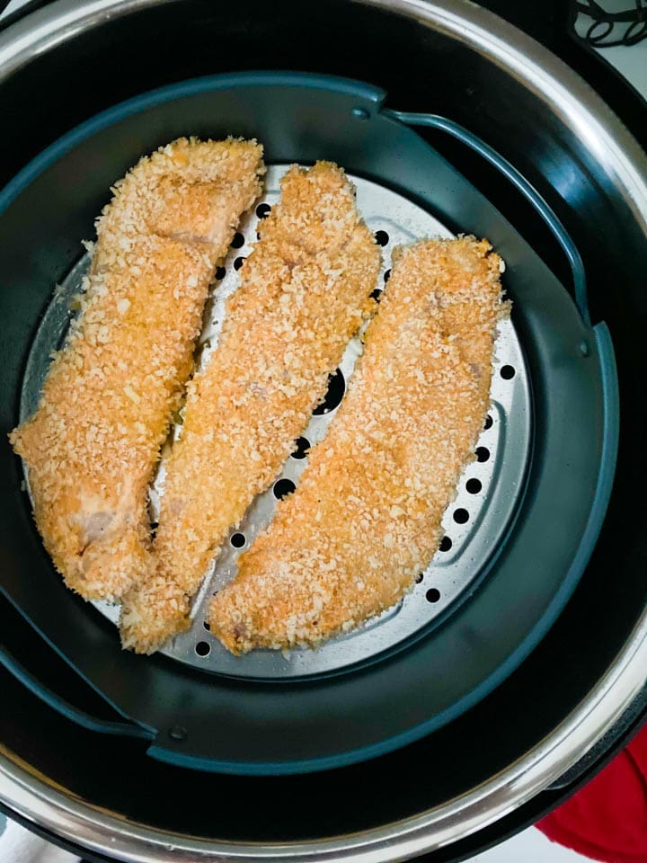 Chicken tenders in an instant pot air fryer basket