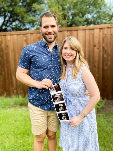 The Dizzy Cook and husband holding their ultrasound photo