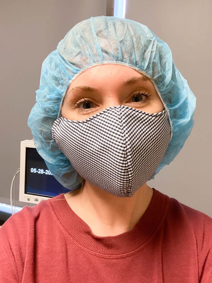 A woman wearing a medical cap before an IVF embryo transfer