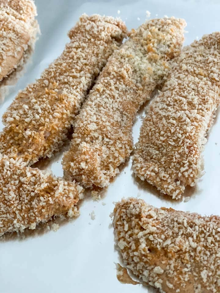 Panko coated chicken tenders on tin foil