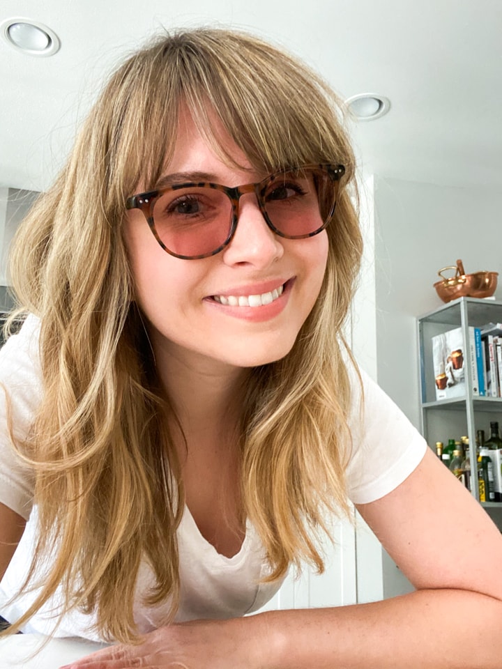 A girl in migraine glasses for vestibular migraine treatment