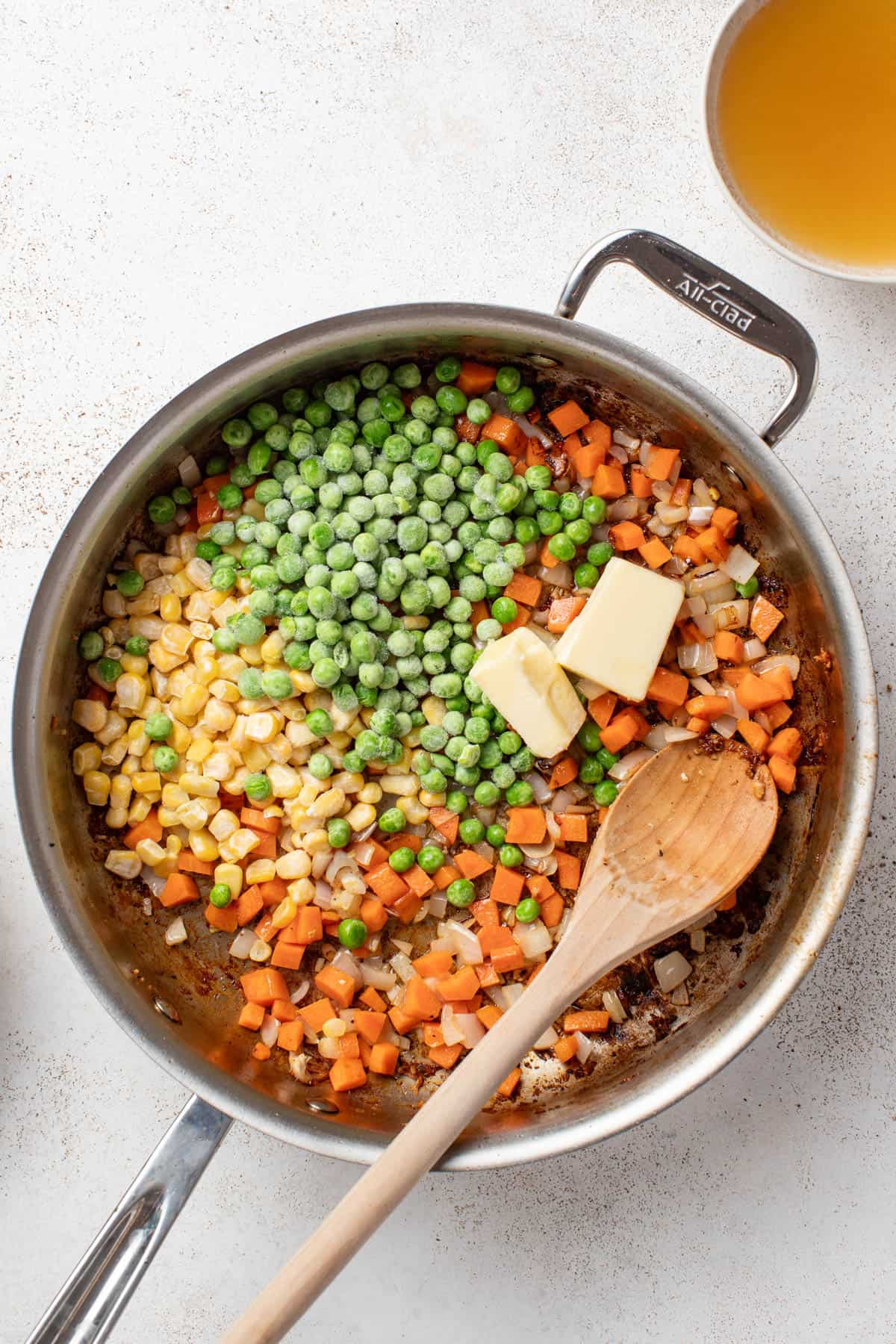 Cooking the vegetables in a stainless still pan.