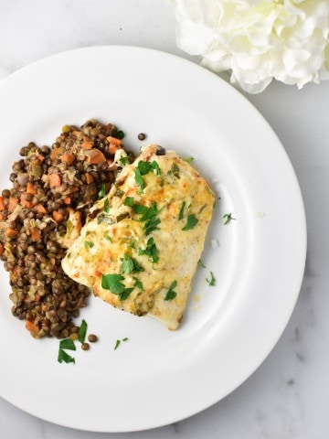 Heavenly halibut on a white plate with lentils