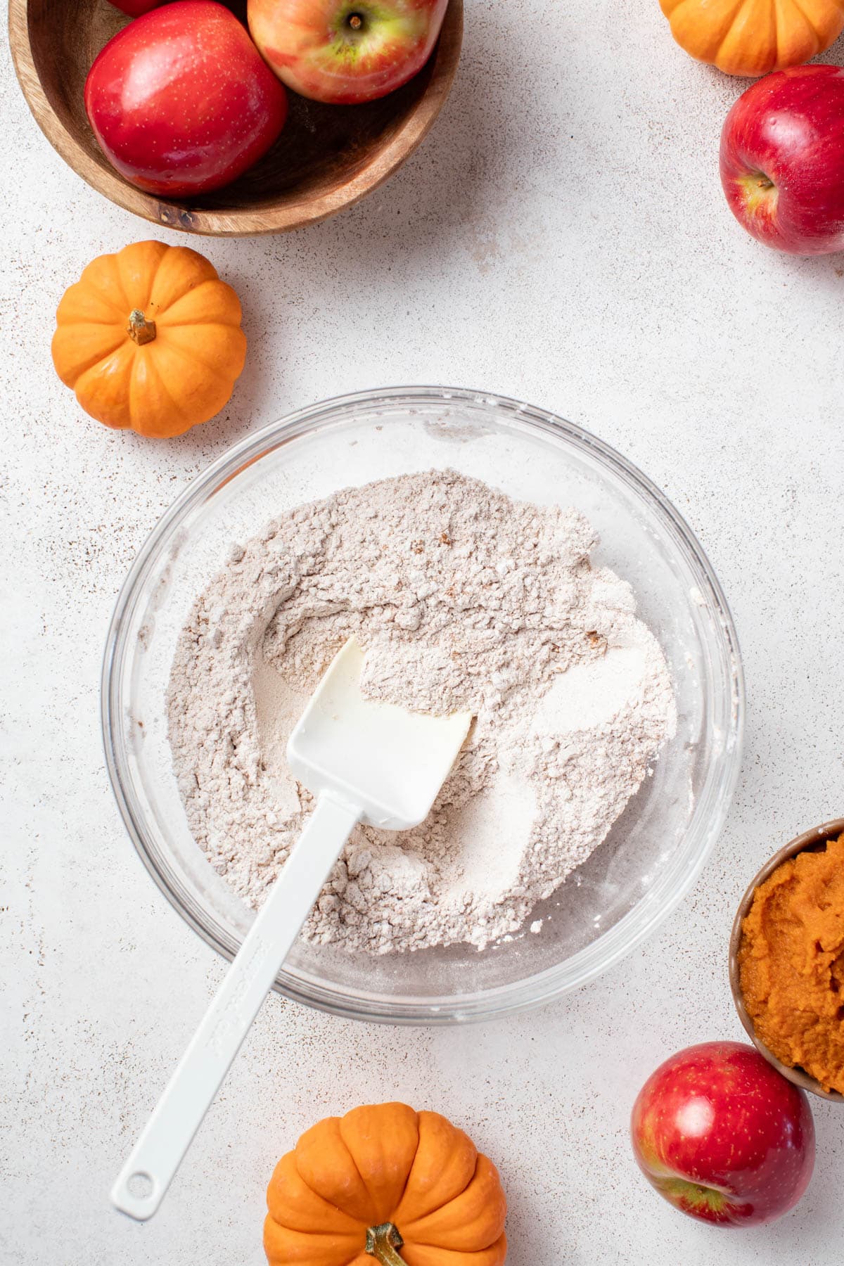 Mixing flour with spices in a bowl.