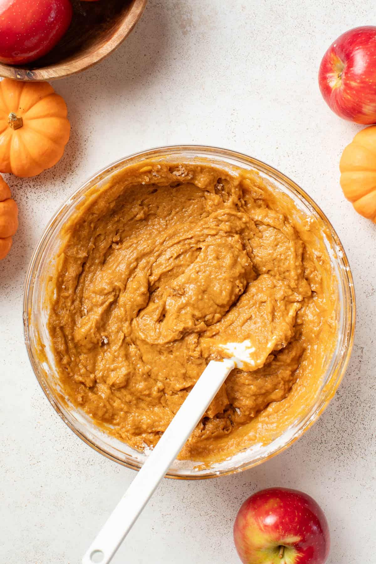 Combining the pumpkin mixture with the flour in a large bowl till fully combined.
