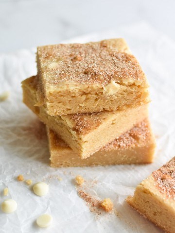 Stacked snickerdoodle blondies with cinnamon sugar on top