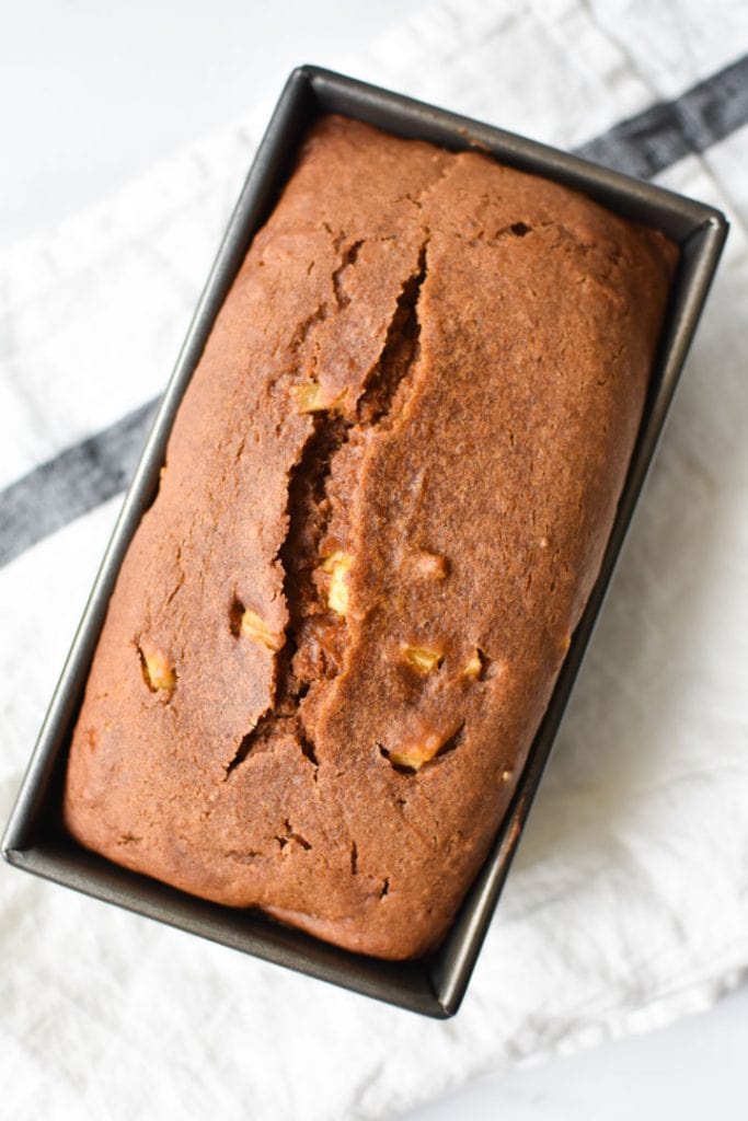 A loaf of pumpkin bread in the pan, just out of the oven