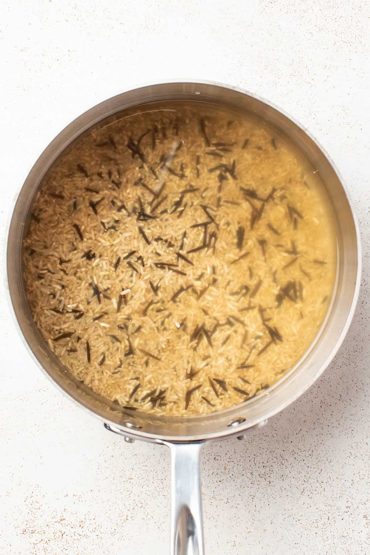 Cooked wild rice blend in a pan.