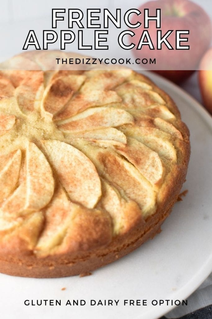 A french apple cake on a white marble serving plate