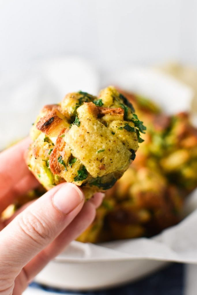 A hand holding a stuffing ball