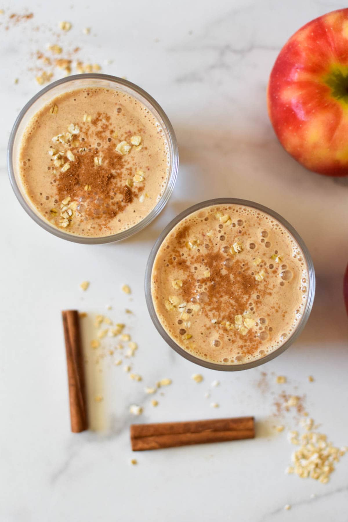 Apple cinnamon smoothies with oats on top. 