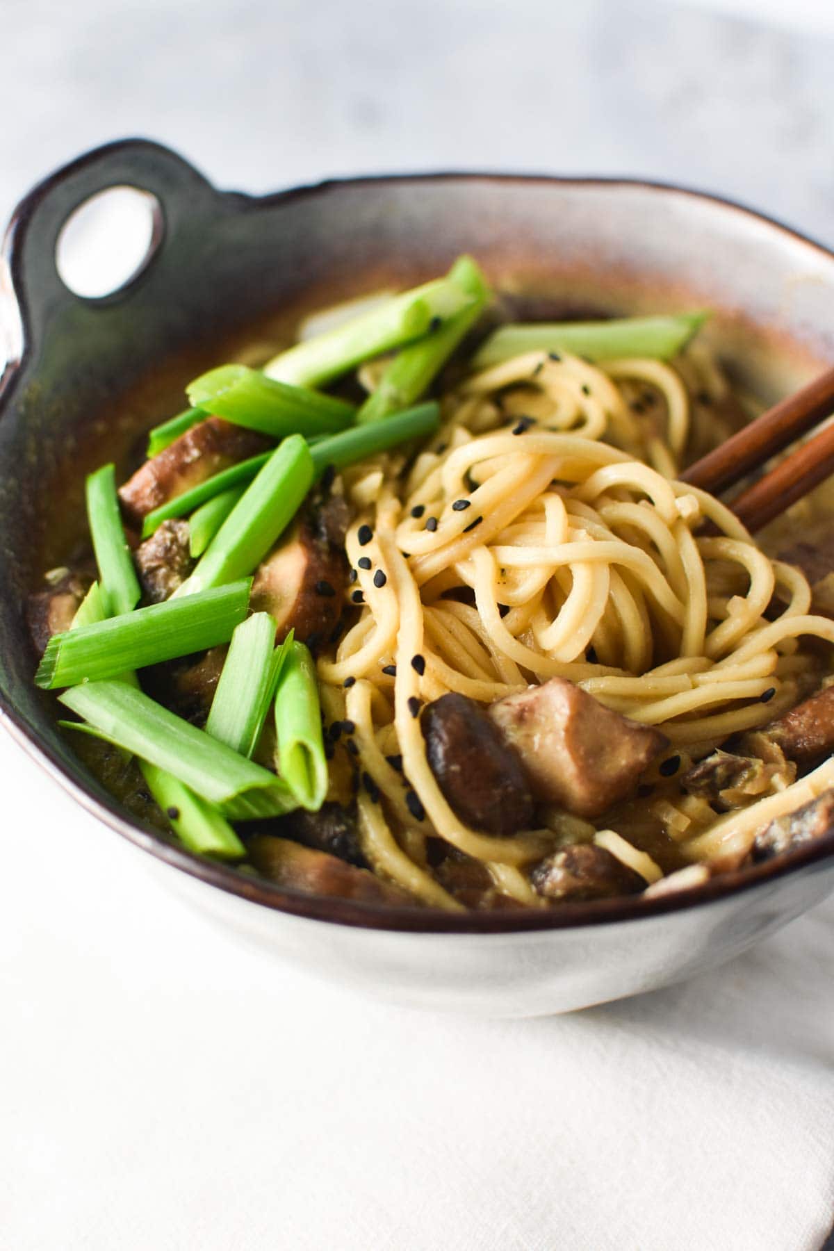 Ramen noodles wrapped around chopsticks