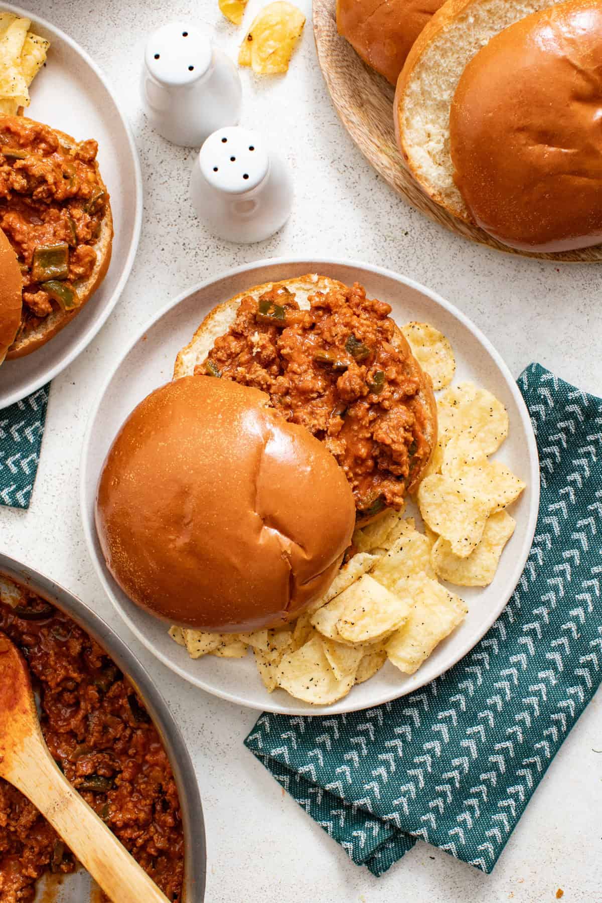 A sloppy joe sandwich in a homemade bbq sauce on a napkin.