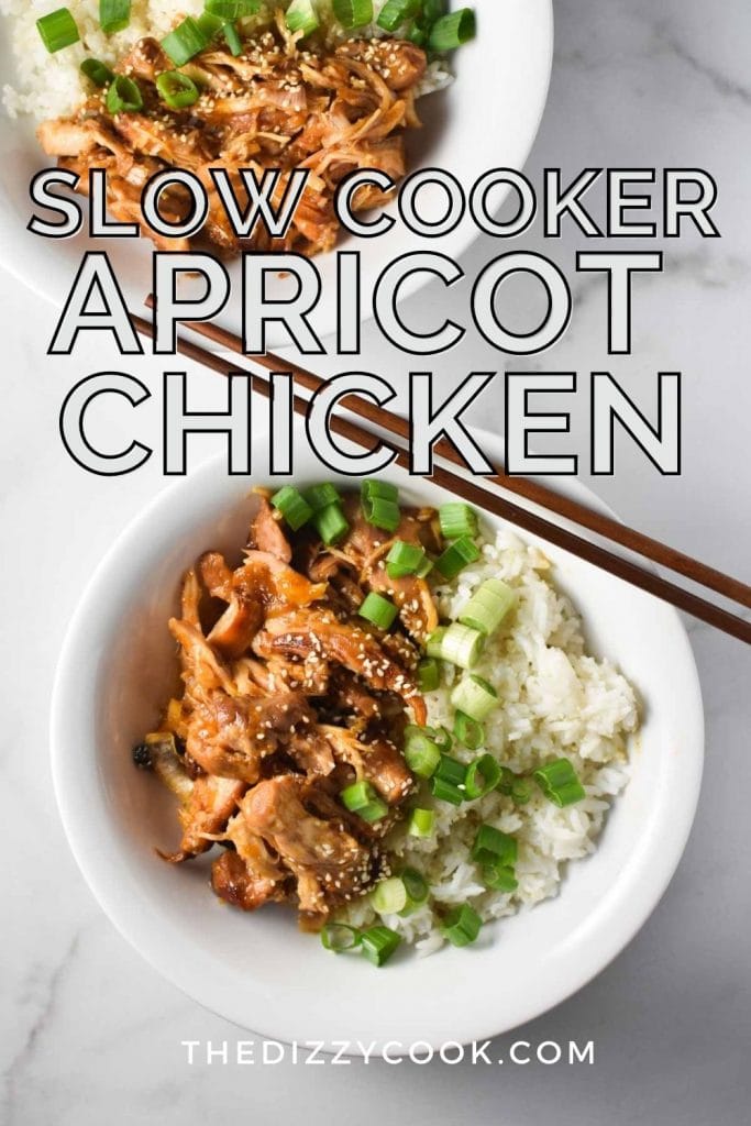 Two bowls of chicken in apricot sauce with rice and chopsticks laying on the side