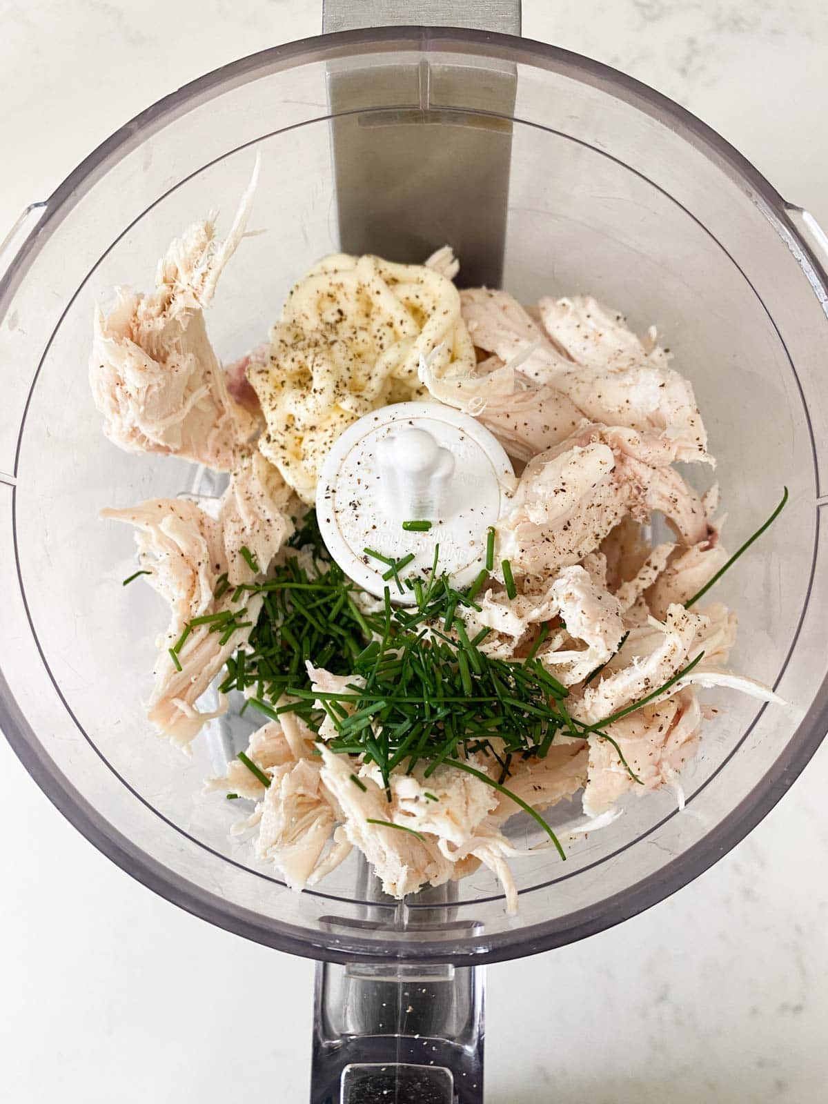 Chicken, chives, and mayo in a food processor