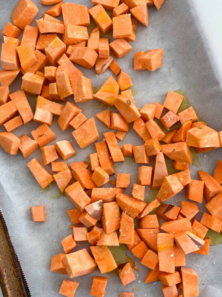 Sweet potatoes being roasted on a pan
