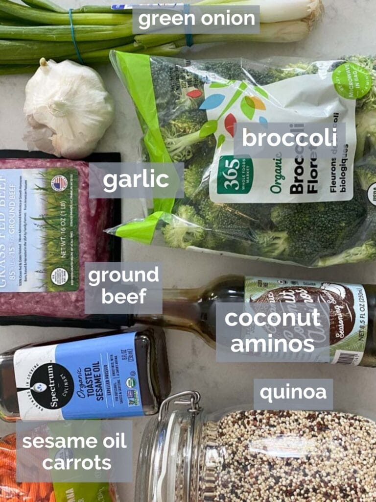 Beef, broccoli, sesame oil, and other stir fry ingredients on a table