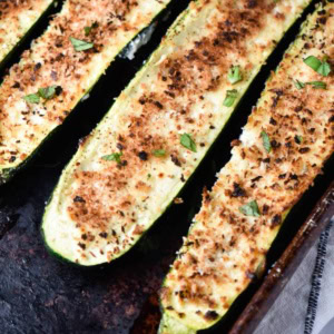 Three zucchini boats stuffed with boursin cheese and panko