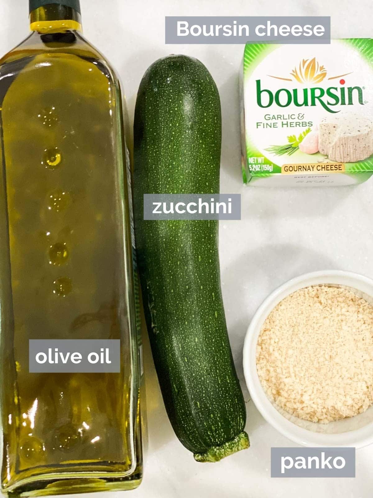 Olive oil, zucchini, Boursin, and panko on a table